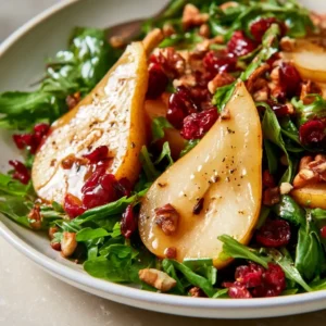 Autumn Pear Salad Recipe With Sweet Pears, Fresh Arugula, Tangy Craisins, Crunchy Nuts, And Balsamic Vinaigrette