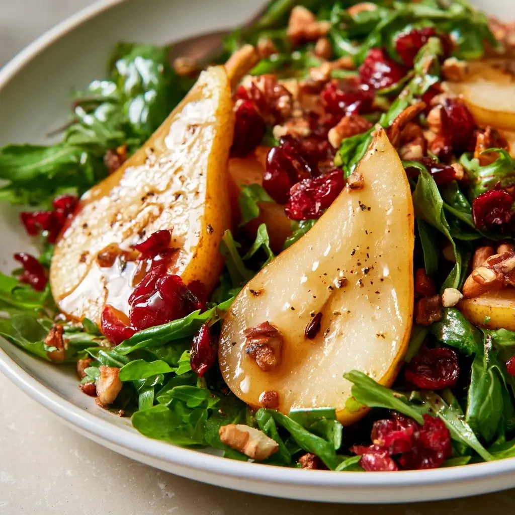 Autumn Pear Salad Recipe With Sweet Pears, Fresh Arugula, Tangy Craisins, Crunchy Nuts, And Balsamic Vinaigrette